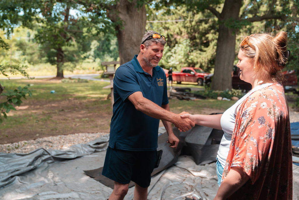 Keyzer Roofing Shaking Hands with Happy Roofing Client